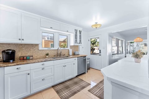 The kitchen is fully equipped with all cooking essentials and features top tier appliances.