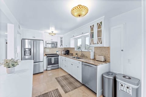 The kitchen is fully equipped with all cooking essentials and features top tier appliances.