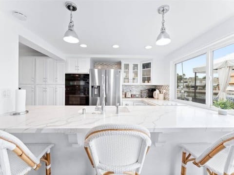 3 guests can sit comfortably at the large kitchen island.