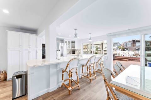 The dining area and kitchen offer plenty of natural light and outdoor access to your private deck.