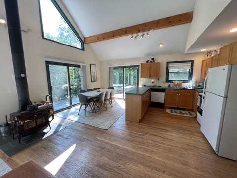 Open concept kitchen cooking and dining area