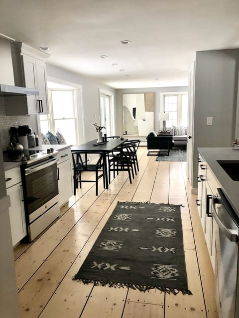 Open concept kitchen, dining area, and living room.