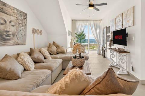 Enjoy breathtaking Caribbean Sea views from the living room, with unforgettable tropical sunsets.