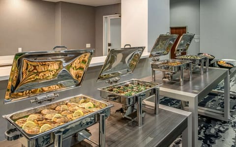 Gather for drinks at the contemporary bar with airy seating.