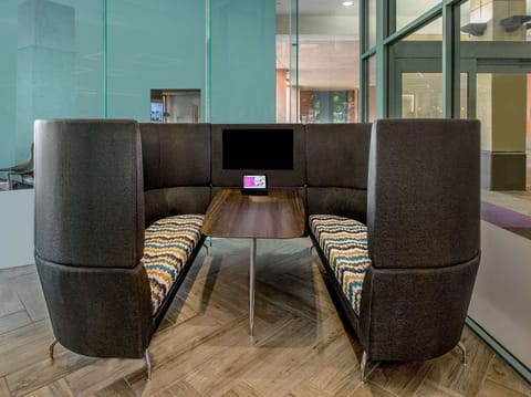 Settle into a cozy booth for chats or quick work.