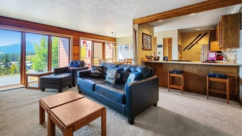 By day enjoy the impressive views from the soaring windows, and by night turn the space into a sleeping area by converting the sofa into the pull-out king size bed.