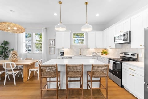 The kitchen is complete with all the appliances needed.