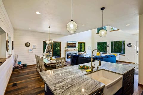 The chef's kitchen is well-appointed with top-of-the-line appliances, offering a gourmet experience for those who love to cook and entertain.