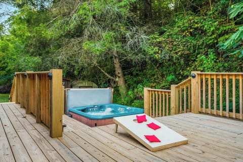 Your own backyard escape—this serene deck features a bubbling spa and fun outdoor games, perfect for winding down after a day of adventure.