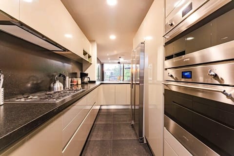 Sleek kitchen with high-end appliances, offering a minimalist and relaxed cooking space.