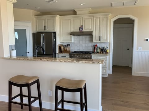 Watch chef prepare meals!Entry on right to half bath and laundry room.