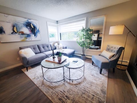 Sink into comfort. This stylish living space is perfect for unwinding with a book to read or watching a few shows on the TV.