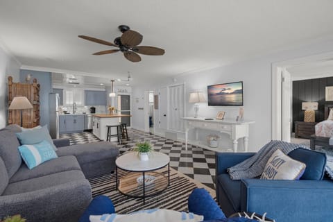 Relax in this modern living room, complete with a wall mounted TV and new furnishings