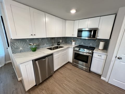 Kitchen- Has an electric stove, microwave and dishwasher