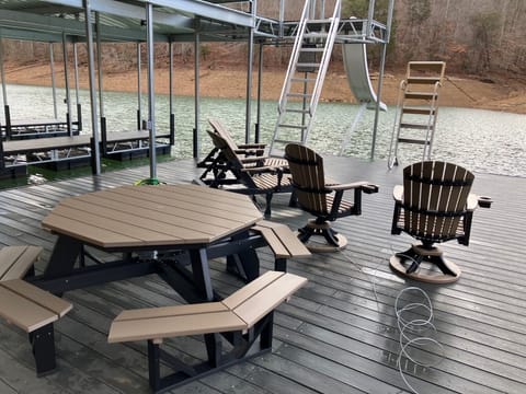 New 2024 - 2 lounge chairs, 2 rocking/swivel chairs, and picnic table at dock.