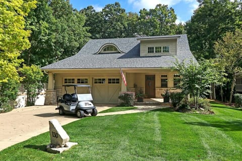 Front of home, parking and golf cart