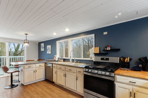 Spacious kitchen with great views and opens up to the back deck!