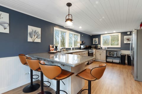 Extra large kitchen with 5 burner gas stove and extra seating! 