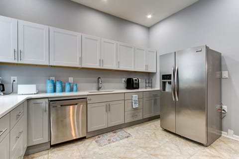 Fully stocked kitchen, with Gas stove, dishwasher, and large fridge.