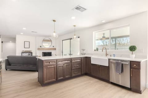 Calcatta quartz on espresso with champagne bronze and stainless finishes!