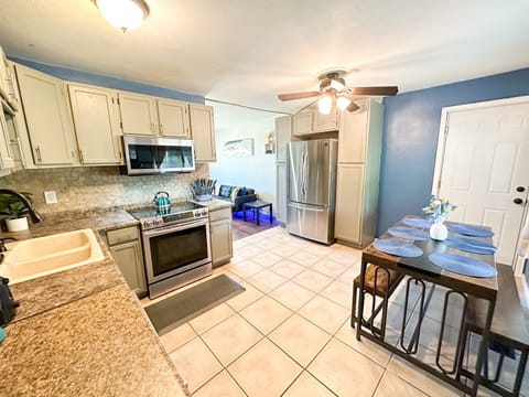 Cook Up a Storm! 🍴🔥 – Discover your inner chef in our well-stocked kitchen, featuring utensils and kitchenware. Enjoy meals with family or friends at the spacious 6-seater dining table.