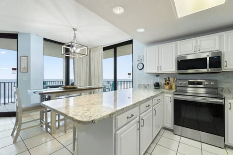 Kitchen is stocked with pots/pans/utensils.