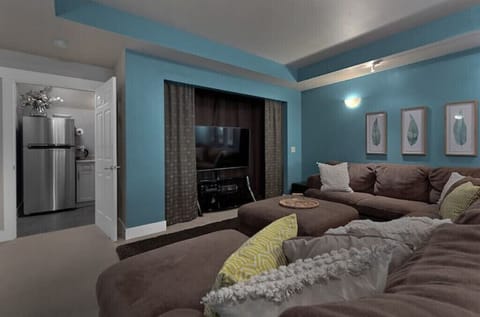 Family Room Large Smart TV Roku with lots of pillows and throw blankets