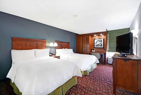 Settle in comfortably with two plush beds and warm lighting.