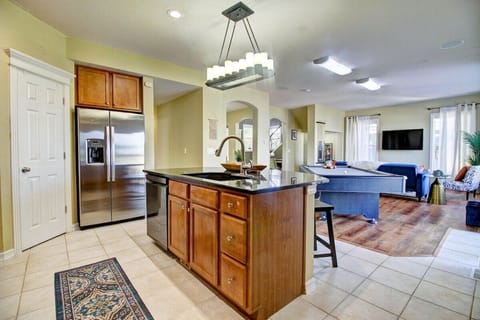 Discover the heart of the home in our main kitchen, featuring a spacious kitchen island with inviting bar seating.