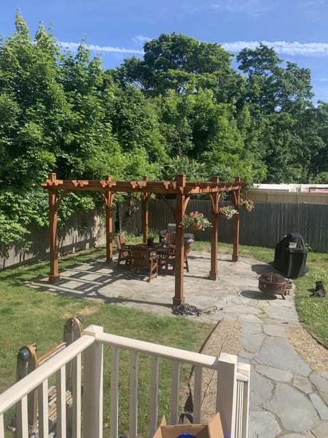 Beautiful outdoor lighted pergola for evening barbecues   