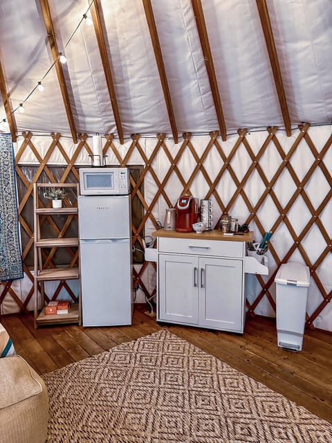 The kitchenette is stocked with all the utilities you need & shelves 