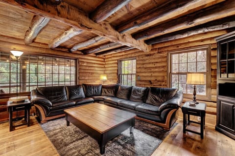 Gorgeous log cabin with exposed log trusswork and original pine floors
