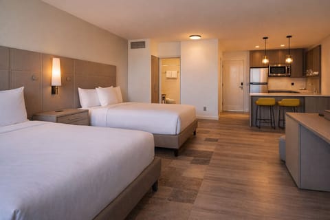 Unpack easily with a handy kitchenette steps from the beds.