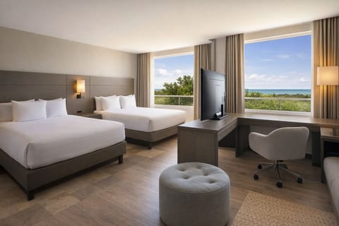 Settle in beside panoramic windows with a comfortable work desk.
