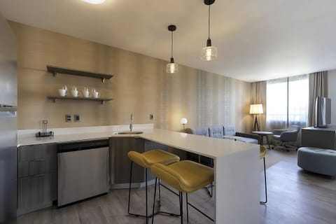 Gather at the sleek breakfast bar for easy meals together.