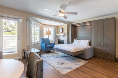 Sink into the plush bed and wake to sunny views.