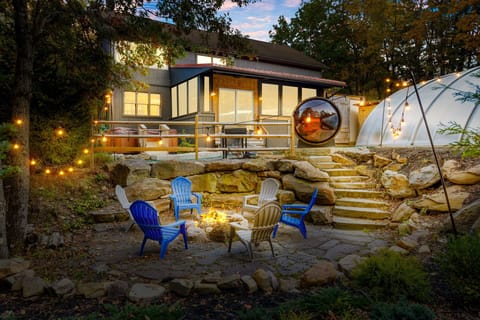 Cozy Outdoor Fire Pit – Relax by the fire with comfortable seating and string lights for a perfect evening.
