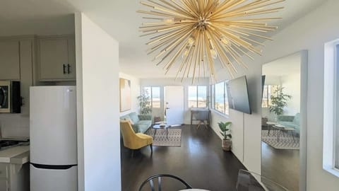 Relax in this sunny open floor plan living room and dining room, overlooking stunning views of the pacific ocean. 
