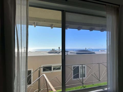 Peekaboo view from the balcony of the Pacific Ocean. This studio is located steps from the famous Manhattan Beach Strand.