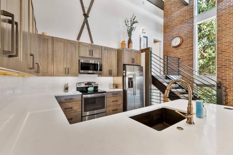 Beautiful, spacious kitchen with quartz countertops—perfect for preparing and enjoying homemade meals!