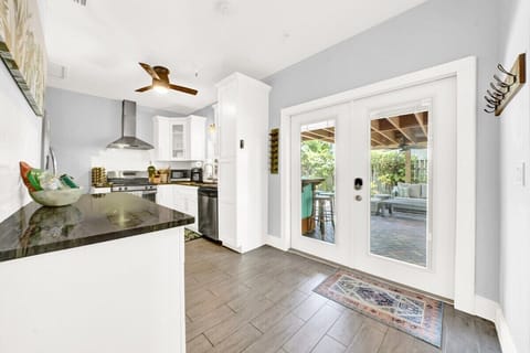 The Flora Cottage kitchen has all the cooking supplies and amenities you'll need to host your group. Enjoy cooking meals in this well equipped kitchen.