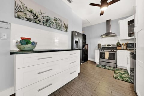 You will enter Flora Cottage into the kitchen.