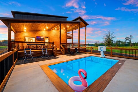 Welcome to Across the Pond our pondside cabin, featuring our heated pool (additional cost to heat). Where you can relax and enjoy your vacation.
