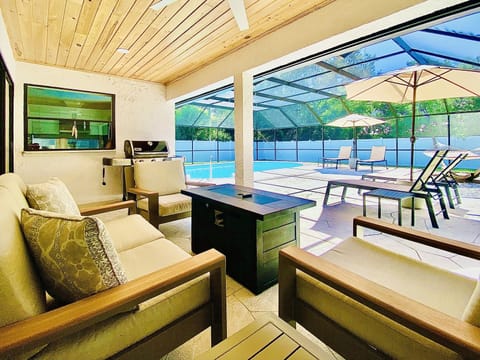Beautiful outdoor oasis with comfortable seating and fire pit 