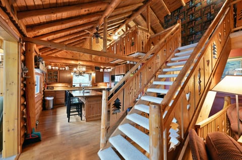 When you come out of the sitting room you will go past the stairs into the kitchen.