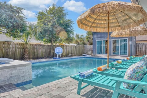 Resort style backyard - pool & spa, lounge chairs, tiki umbrellas, pool basketball, fire pit, bbq grill, surf board outdoor shower, detached bunk house, outdoor table seating, outdoor sectional.