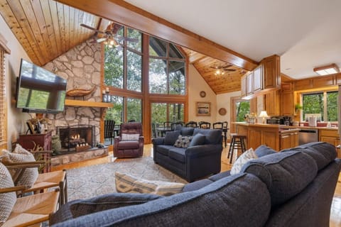 Enjoy an open living room and kitchen with plenty of light from the windows that face the lake