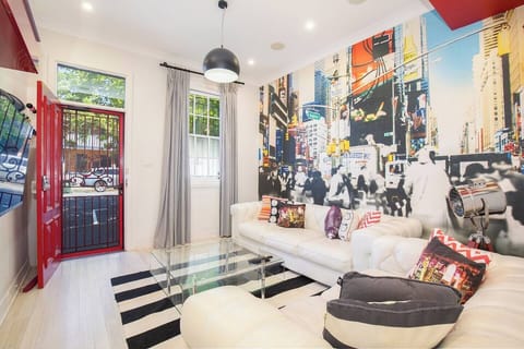 Step through the ruby red front door to find the eclectic living area, providing a bright and comfortable spot to kick back with some Netflix.