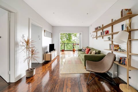 Polished timber floorboards and minimalist finishings complement a naturally-lit space with a breezy open plan layout