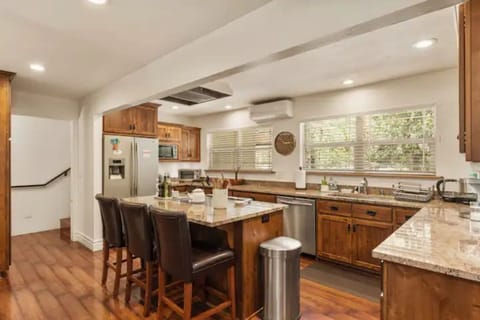 FULLY stocked kitchen with counter seating for the chef in your party.